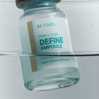 Close-up of the SLOAID Stage 3 Define Ampoule vial partially submerged in clear water