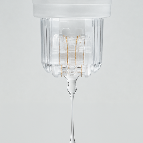Close-up of the Roller Gold device dispensing a clear serum through its gold-plated micro-needle roller head.